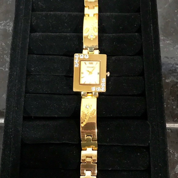 Pak Fook Goldstone watch w/floral-crystal accents. - Picture 2 of 8